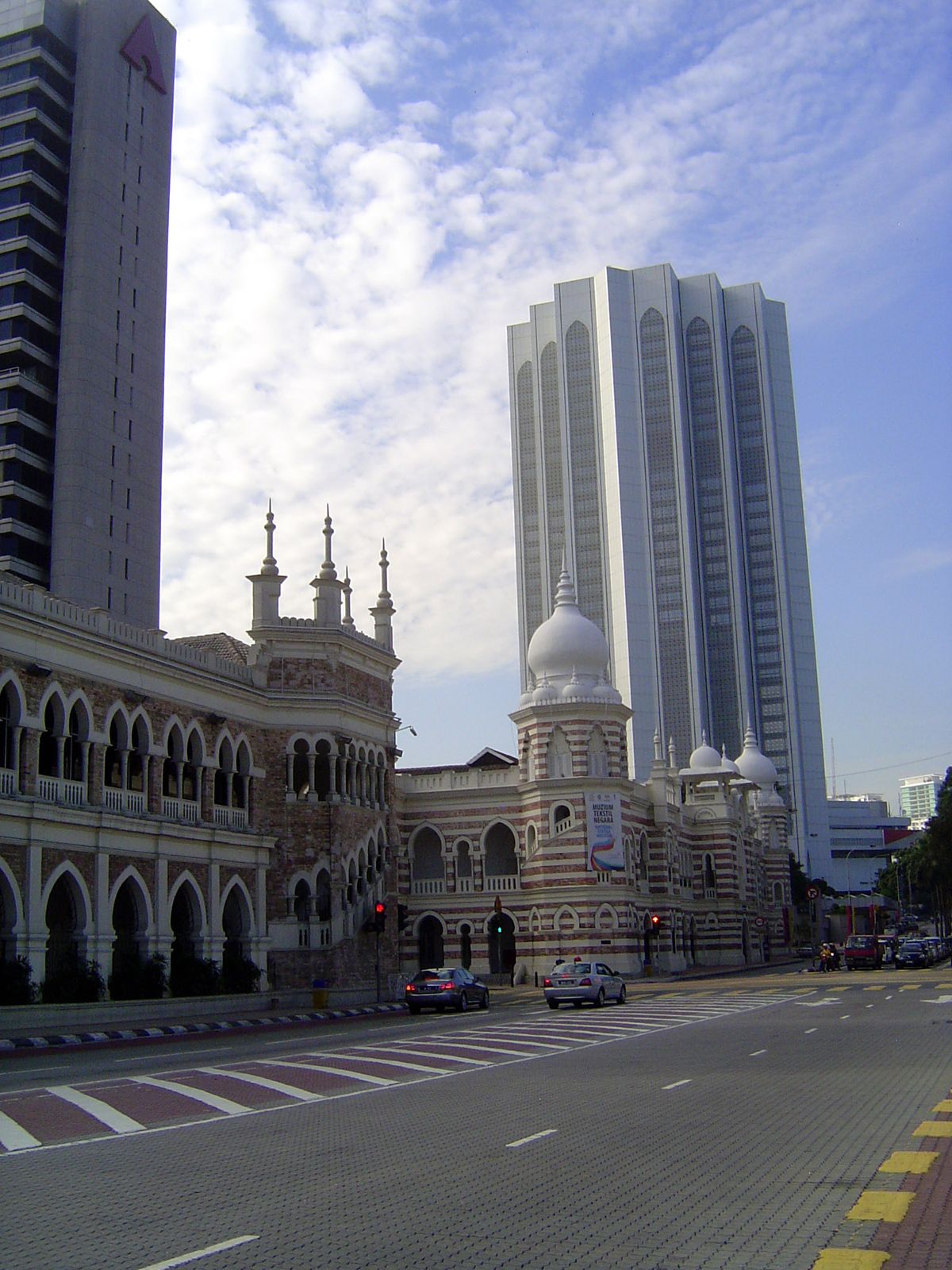 On the left and shown at the right side of the previous image is the former post office, added in 1907. Across the street is the former head