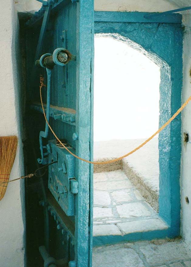 The main door, with iron plating and bolting.