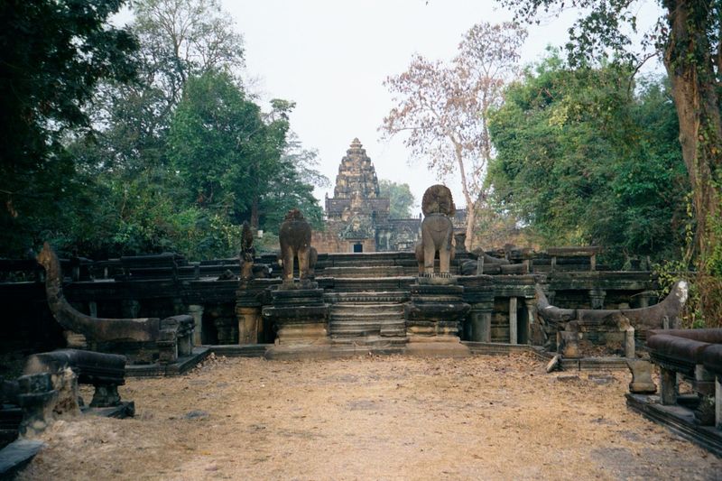 Here they are, with the temple's lone lotus tower rising between two lions.