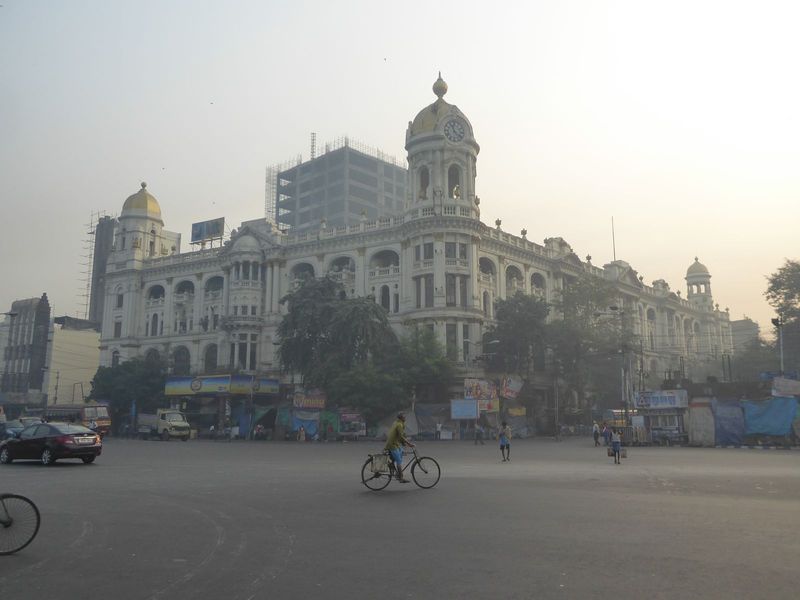 We're looking east from the tower across the expanse of the intersection of Chowringhee the car's heading north on the street and Banerjee R