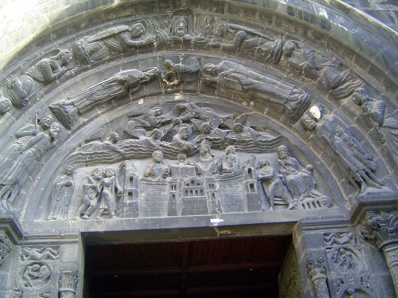 The limestone tympanum over the right-side door of the west front has scenes from his life.
