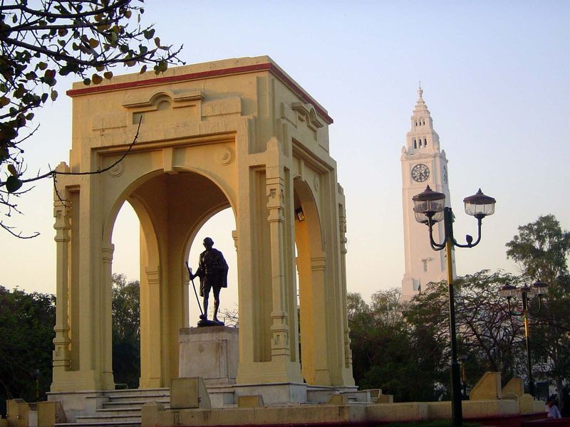 The Post Office tower rises a bit threateningly behind a kiosk itself fairly threatening a fragile Mahatma, as much a figure of the British 