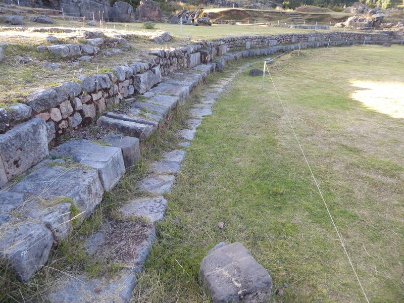 It's a reservoir equipped with channels for filling and draining, but the seating suggests a ceremonial function as well. Ritual bathing cer