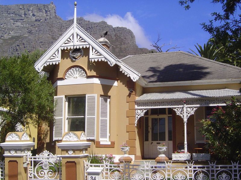 Another, on the same short street, with a bargeboard gable and cast-iron veranda.