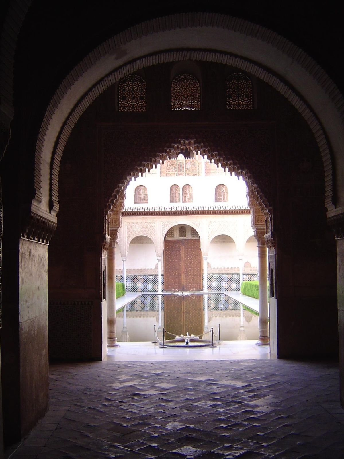 A third view of the same courtyard, this time from the Sala de la Barca, a summer bedroom looking south to the patio; behind the camera is t