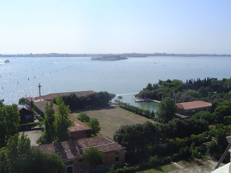 The Lido is across the lagoon; beyond lies the Adriatic. The piles indicate safe channels. In the foreground, of course, is a bit of the Iso