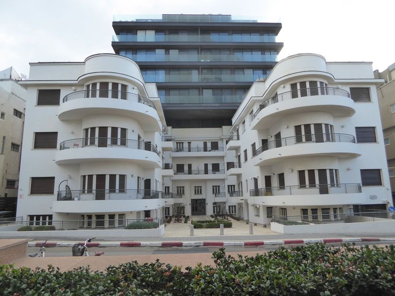Here's a 1935 apartment house at 87 Ha Yarkon. Units here don't come cheap, as the 2012 addition suggests.