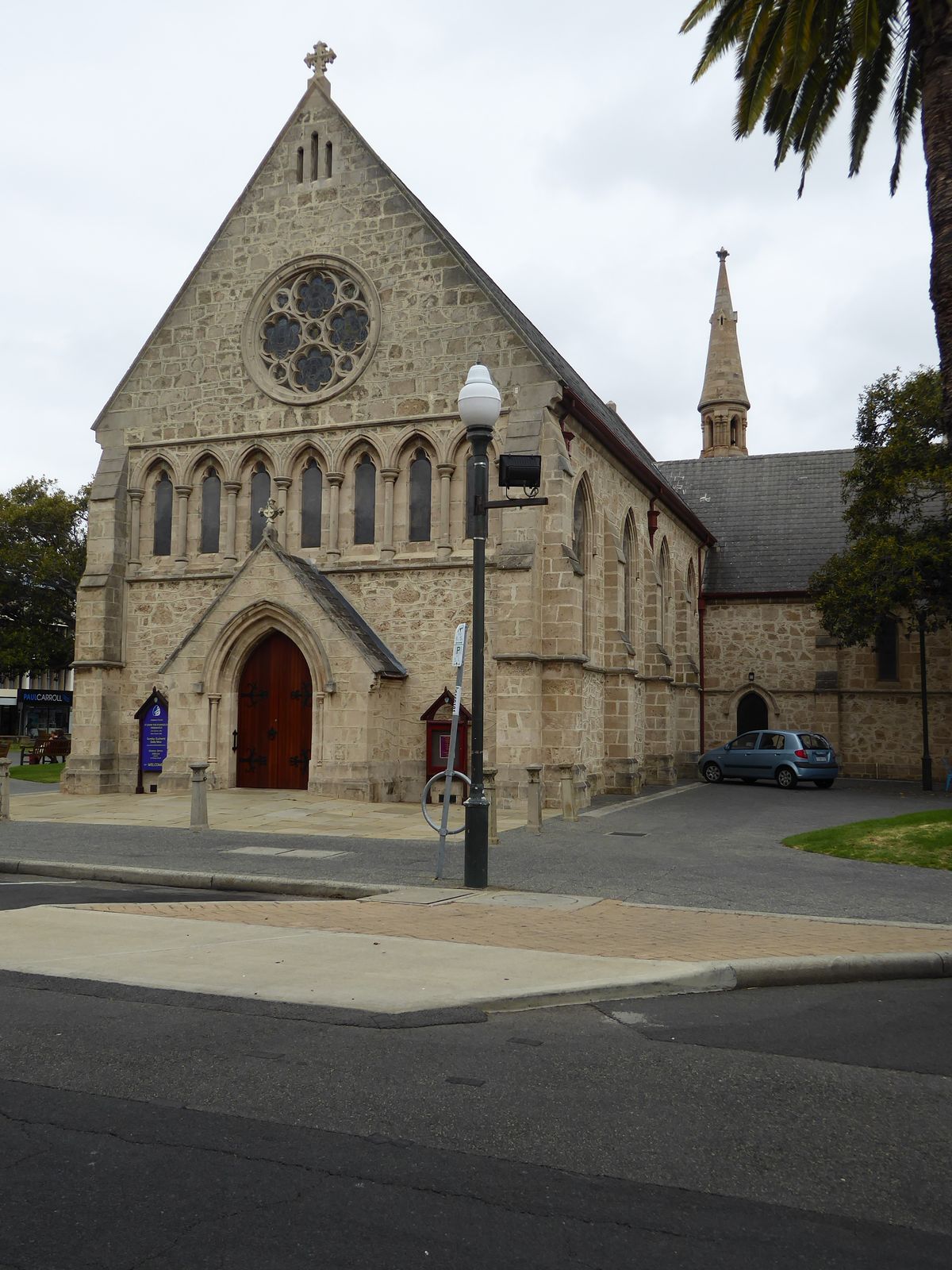 Next door to the town hall of course there's an Anglican church—hand in hand we go. It's St John's Anglican, 1882, replacing an older buildi