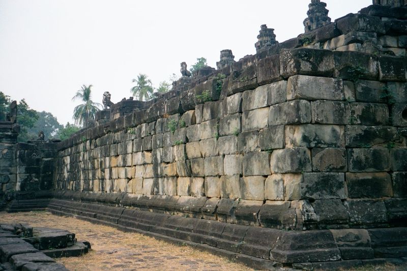 In what would remain standard Khmer practice, the temple was laid out with concentric walls: this is the inner wall, of massive sandstone bl
