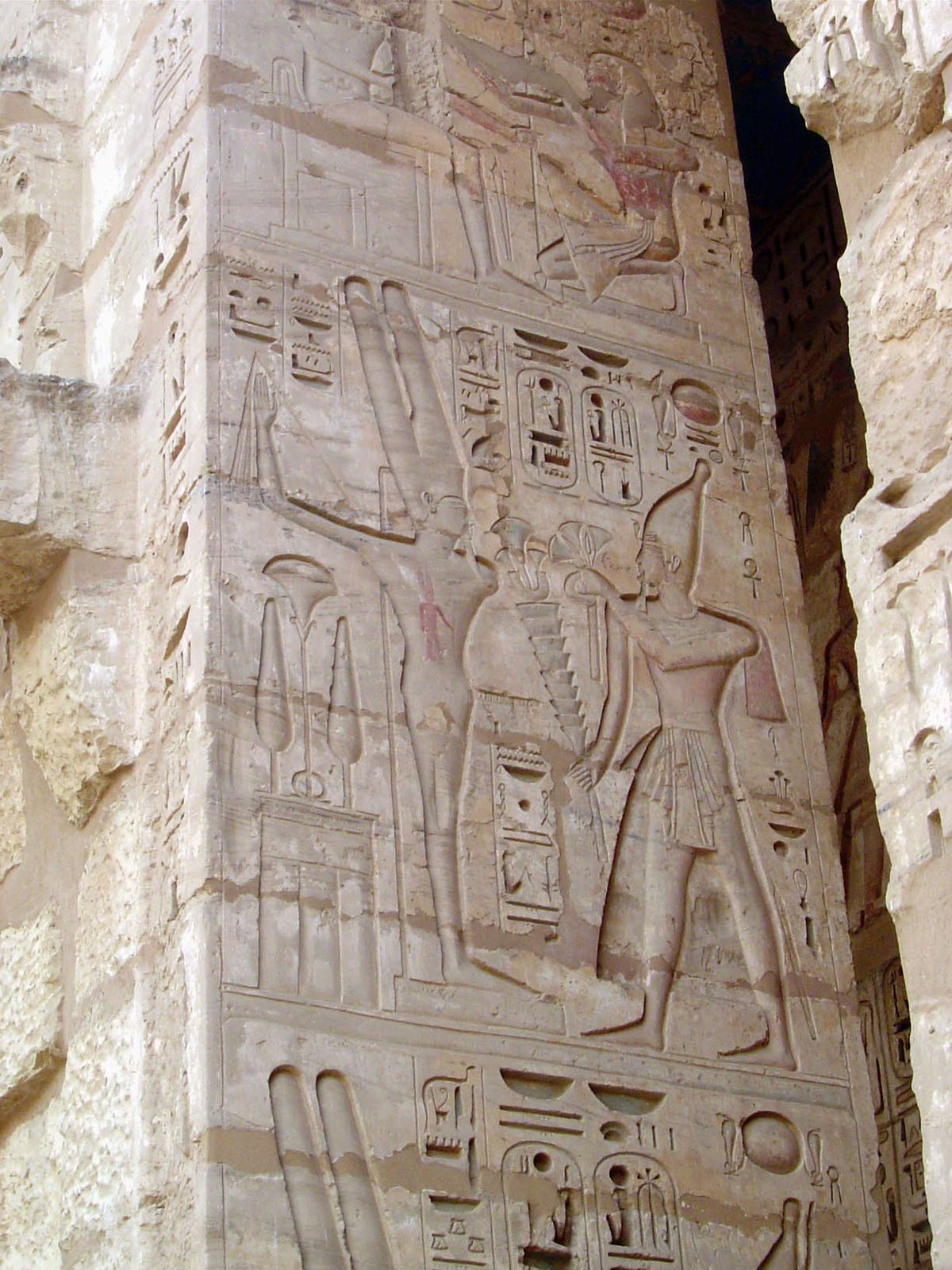 The west face is covered with images of offerings to the gods, in this case Ramesses III making an offering to Amun-Ra.