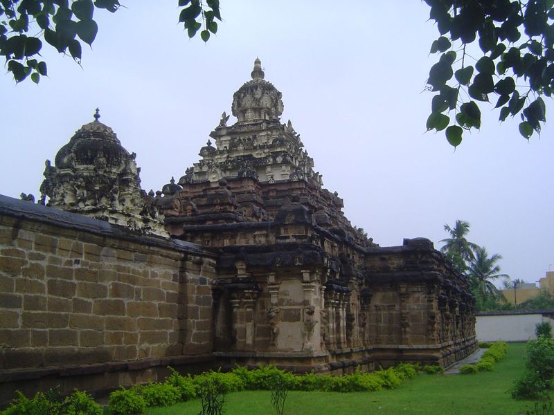 Step to the side and you see the temple's original wall, which encloses an unusually high vimana, literally a "palace" but figuratively a sh