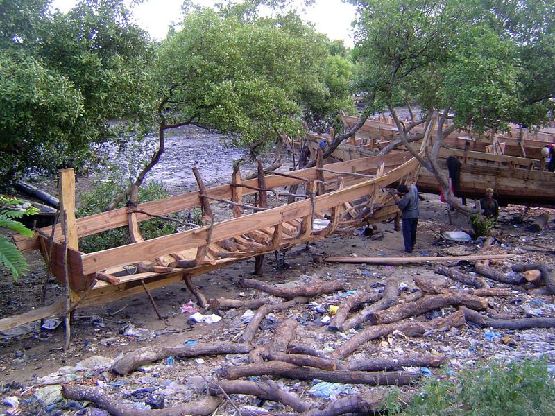 How about now? It's a dhow shipyard, and the men use no power tools, no power saws even. Everything's done the old way.