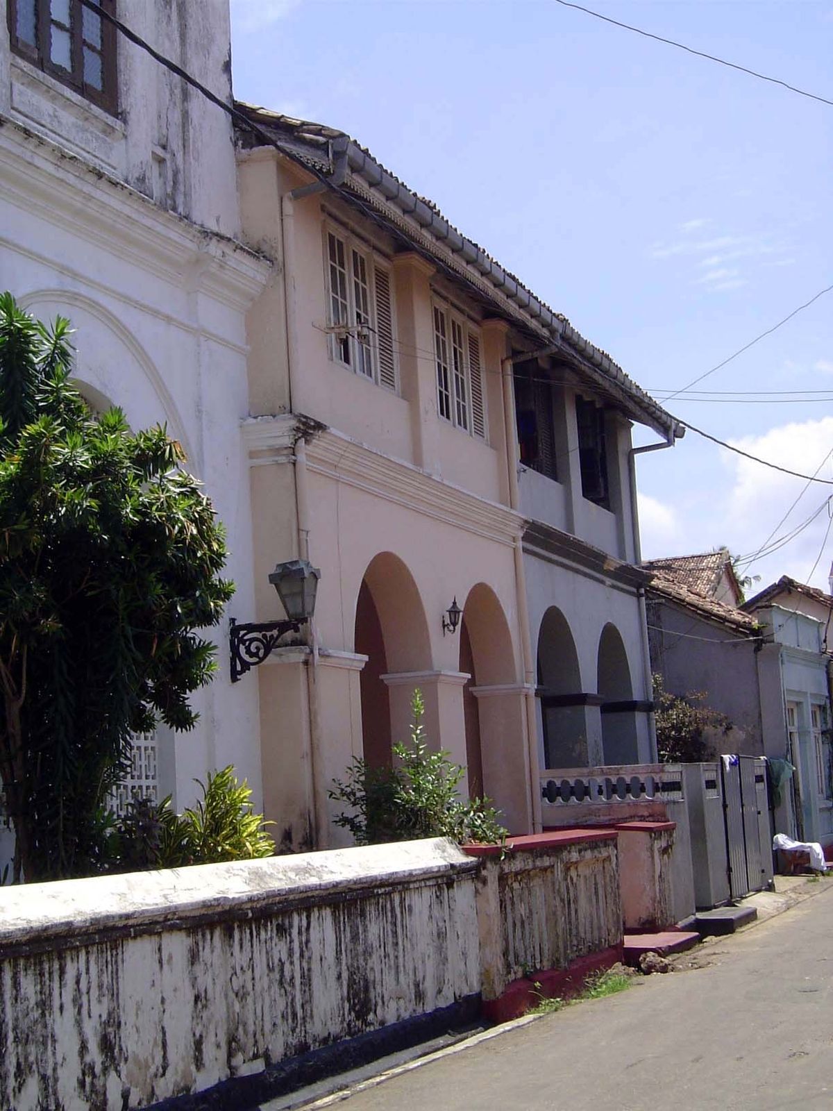 For sale, as is, for about USD 100,000. That's just the building behind the pink facade. You'll have to gut it.