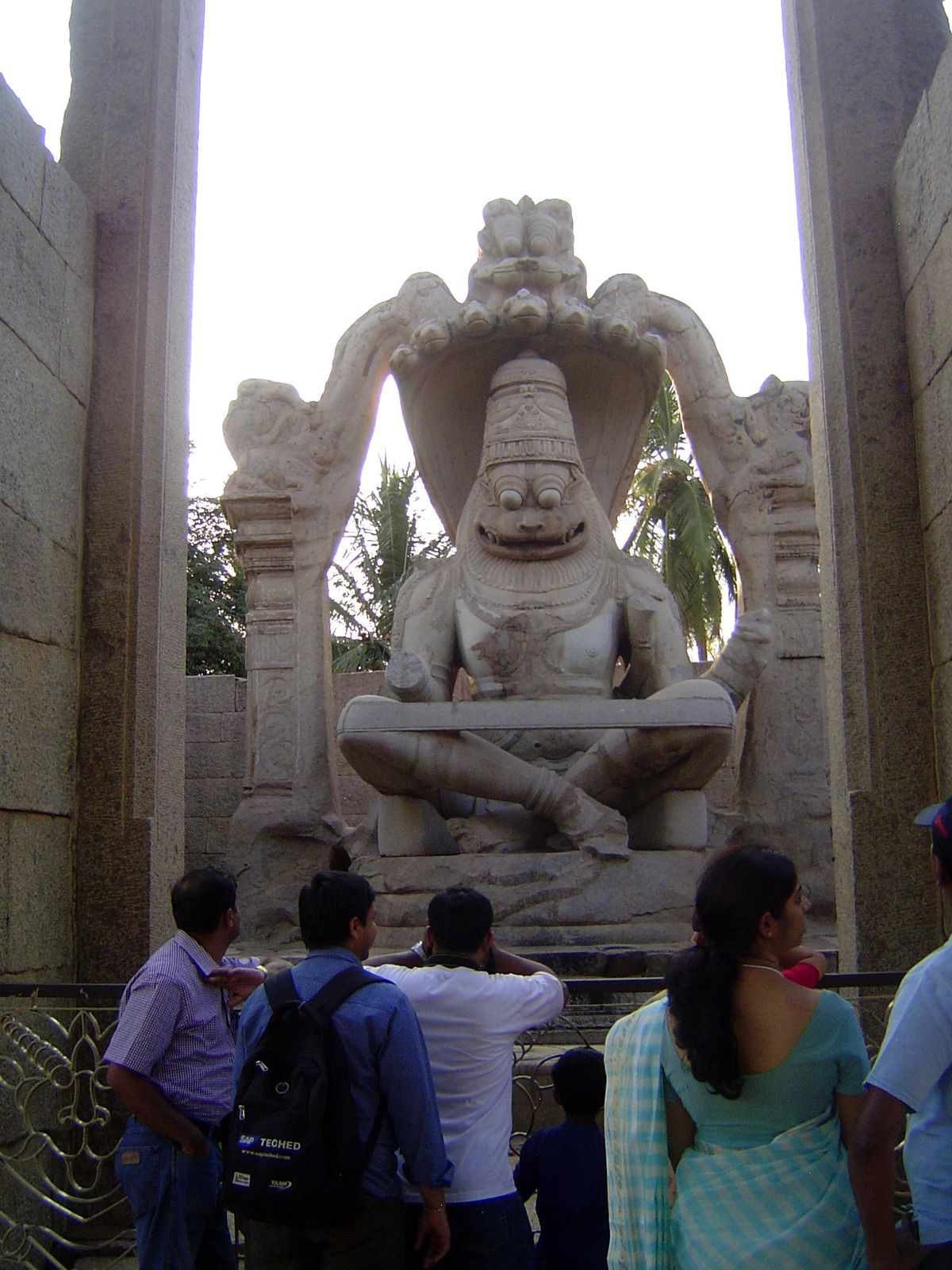 Nearby is a very popular monolithic Narasimha, under a canopy of Shesha, the naga king. Scary? He's not supposed to be friendly. An inscript