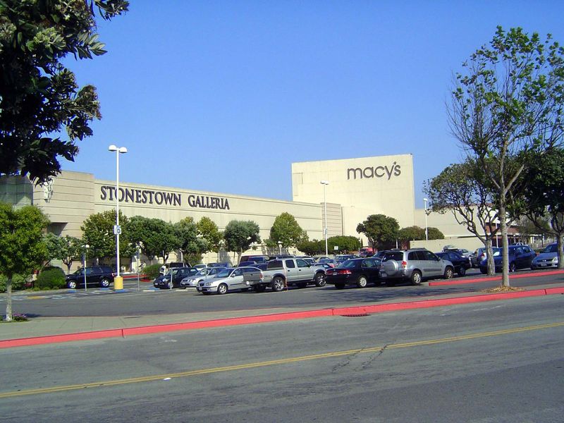 In the other direction from his home, the boy often went to this shopping center, competely boring unless you knew—as of course boys did—tha