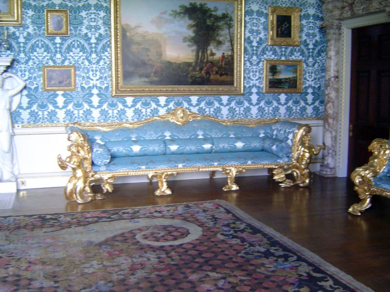 Gilding is the order of the day. The sofas were designed by Adam and have dolphin feet and merfolk supports.