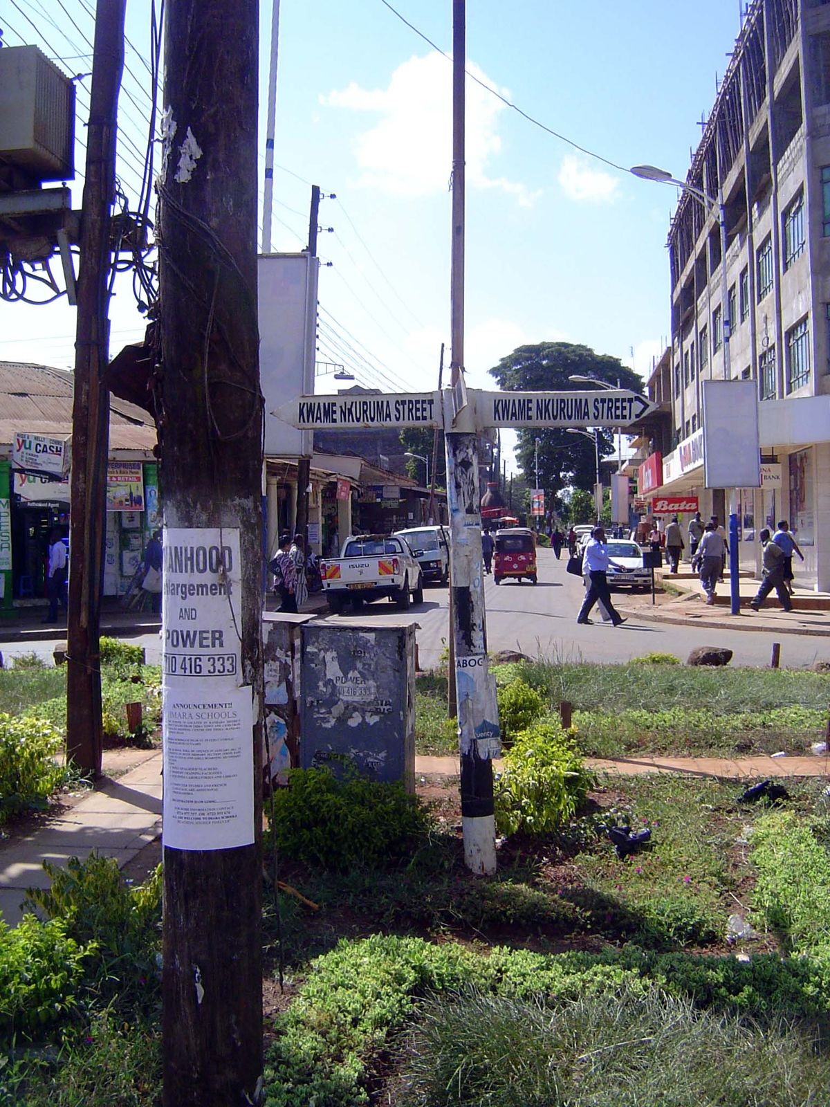At the intersection, the street sign is 90 degrees out of true; in the foreground, a local alternative to Viagra.