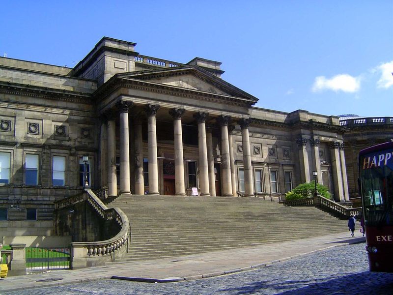 A few blocks farther east, this is the city library, paid for by William Brown, a local businessman. The steps were added in 1902, and the b
