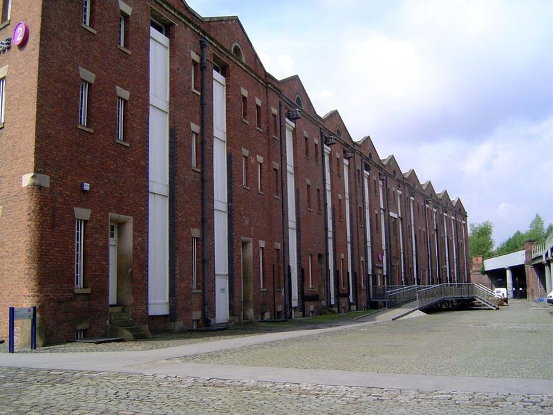 Behind the station building is a three-story cotton warehouse from the 1830s.