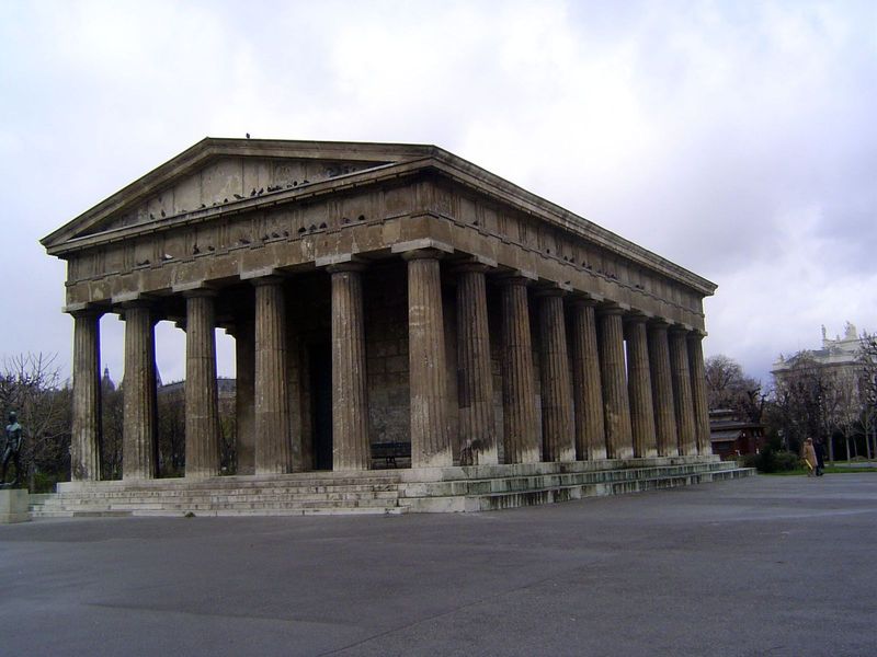 Behind Karl is the Theseus Temple, designed by Peter von Nobile to accommodate a sculpture by Canova of Theseus slaying the Minotaur. The st