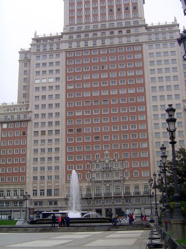 The Edificio España, rising behind the Cervantes Monument, was completed in 1953 as Spain's tallest building. Owned from then until 2005 by 