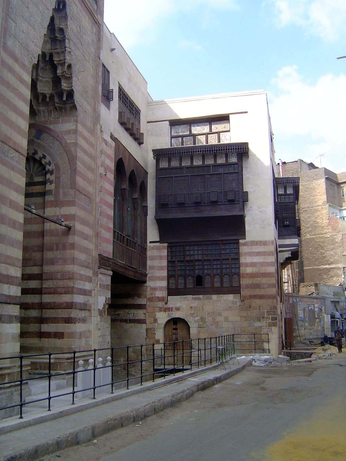 Nos. 235 and 125 Still farther up the street, the Madrasa of Umm al-Sultan Sha'ban and the House of Ahmad Katkhuda al-Razzaz, nearing the en