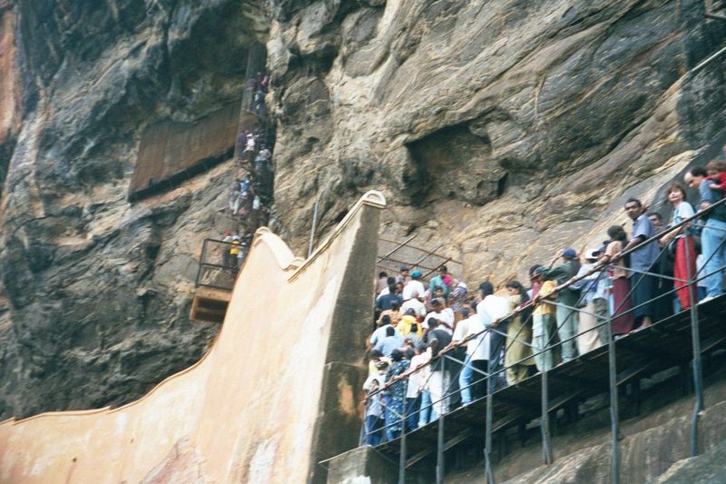 The wall is an ancient one, supplemented by the modern catwalk and the spiral staircase, which deadends against a wall of frescoes.