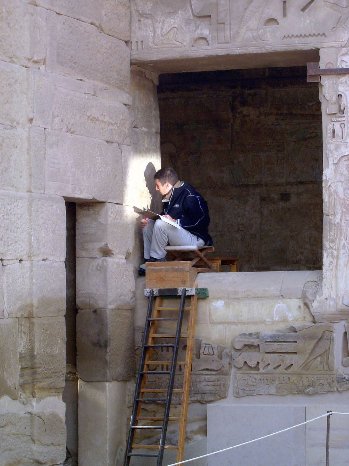 He's beaming light to a member of the team fielded by the Oriental Institute of the University of Chicago. How's that for "appropriate techn