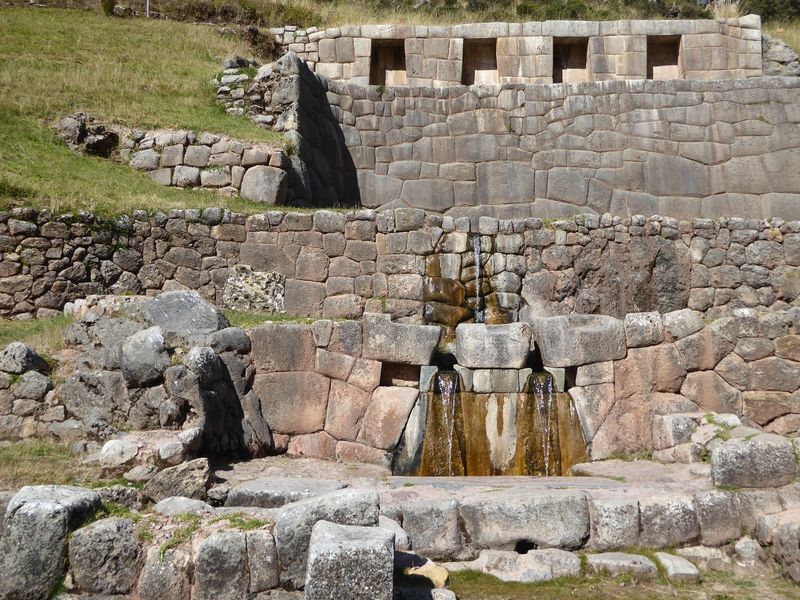 You can ask the same question about the stonework, too. Frustrating that you won't get answers. The one-spout, two-spout pattern will be see