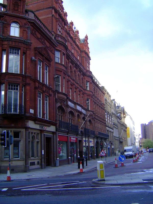From the Town Hall steps and looking down one side of Castle Street. At the end of the block is the khaki-colored former Bank of England bui