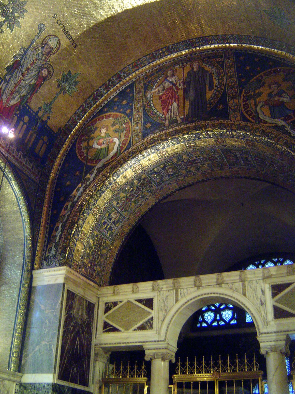The same chapel is kind enough to label St. Cuthbert, the reluctant bishop of Lindisfarne; he is conventionally shown carrying the head of O