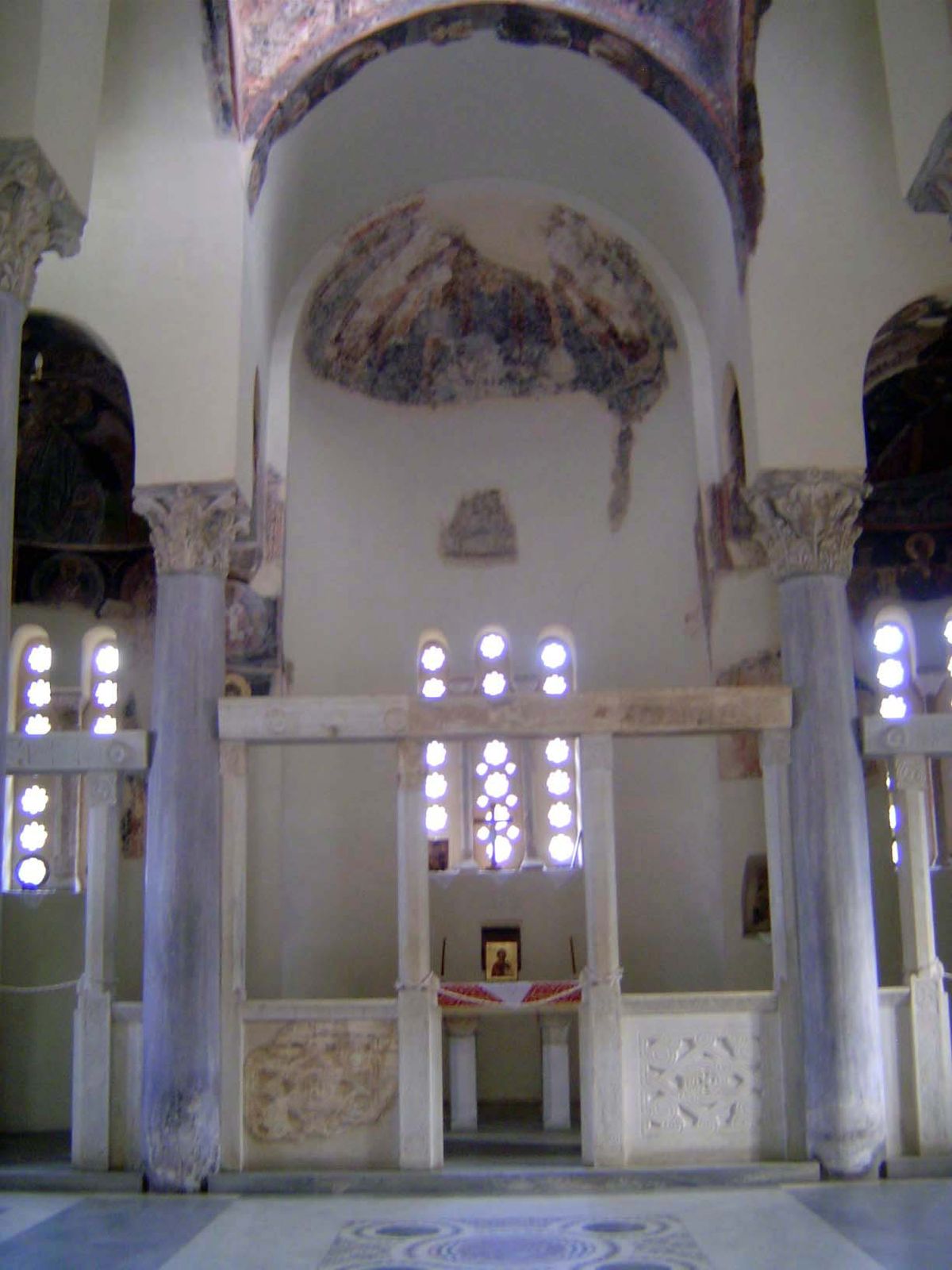 The central dome rests on ancient, reused columns and capitals. The floor plan has four arms of equal length, but the corners have been fill
