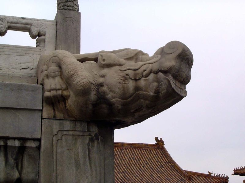 All the balustrade posts have gargoyles in the shape of hornless dragons, or chi. Decorative, the gargoyles are also functioning spouts, car