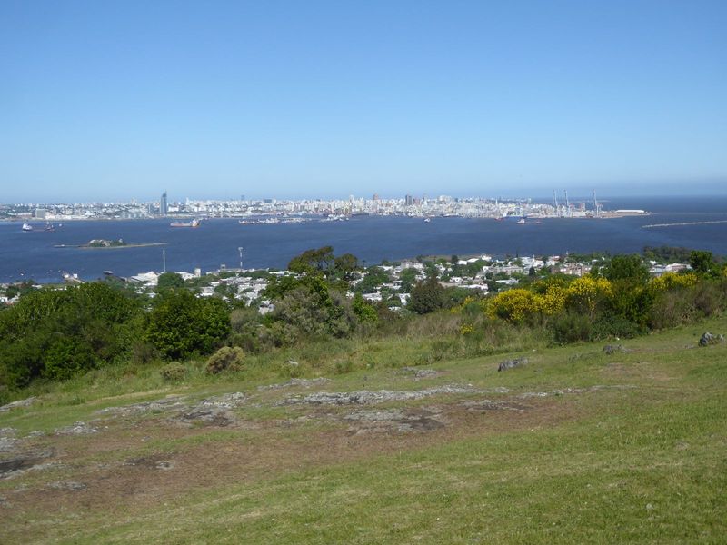 There's a fine view across the harbor to the Mulhall's "tongue of land." Three ship-to-shore cranes stand at the tip of the tongue, a penins