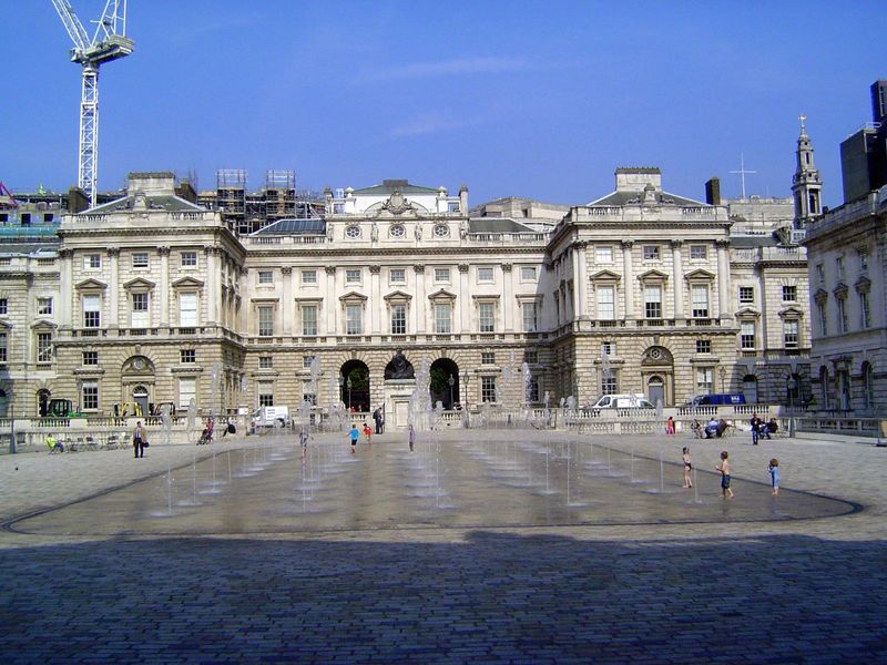In between the two facades, there is a very large courtyard, over 300 feet square. The fountain, of course, is entirely new, from 2000. How 
