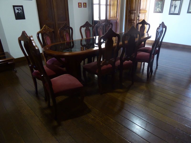 A central room has some reminders of the glory days. That's Albert on the wall, of course. Maybe the furniture's antique. Nice floor.
