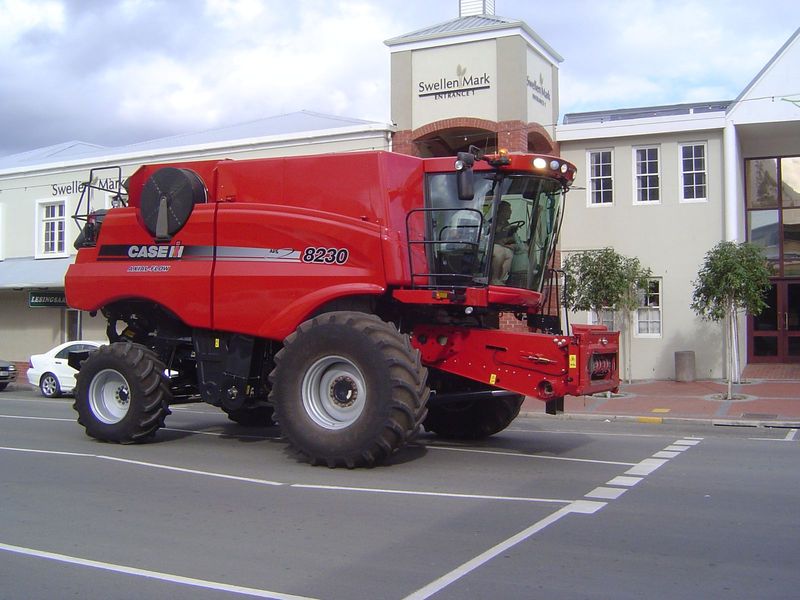 Swellendam is in the center of an agricultural area, as this combine suggests as it rumbles to the fairground. Behind it: the town's shoppin