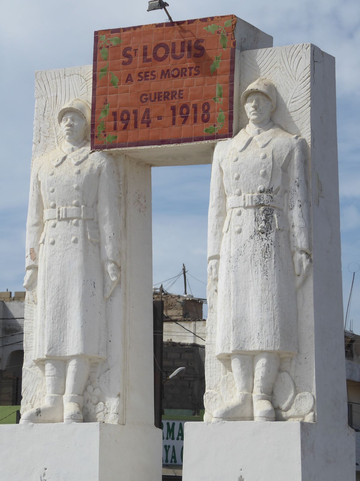 No plaques or insignia but the imagery of French-and-Senegalese-together recalls the Demba and Dupont statue in Dakar.
