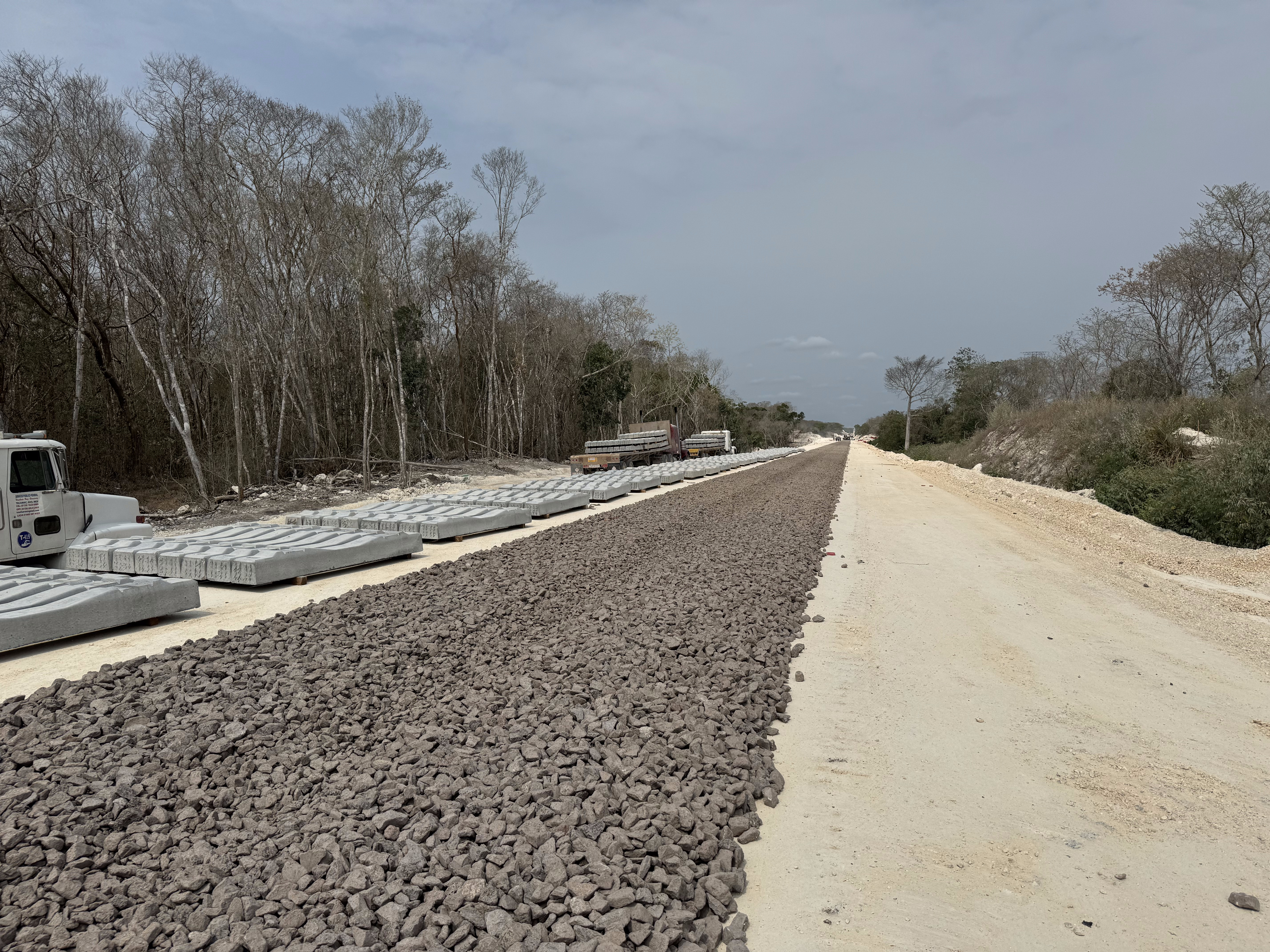 The highway west from Xpujil sometimes parallels the Maya Train, nearing completion in April, 2024.