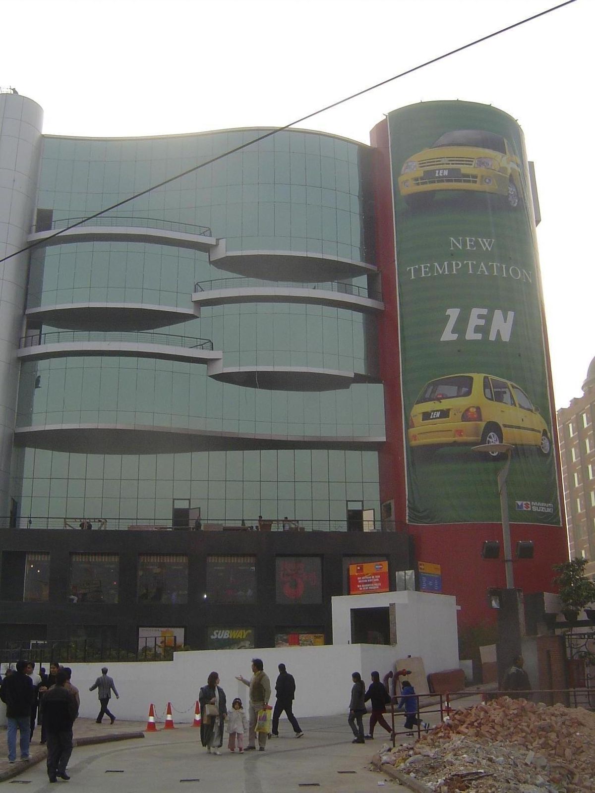 The sign promotes a new model Maruti, the Indo-Suzuki vehicle that revolutionized India's car market.