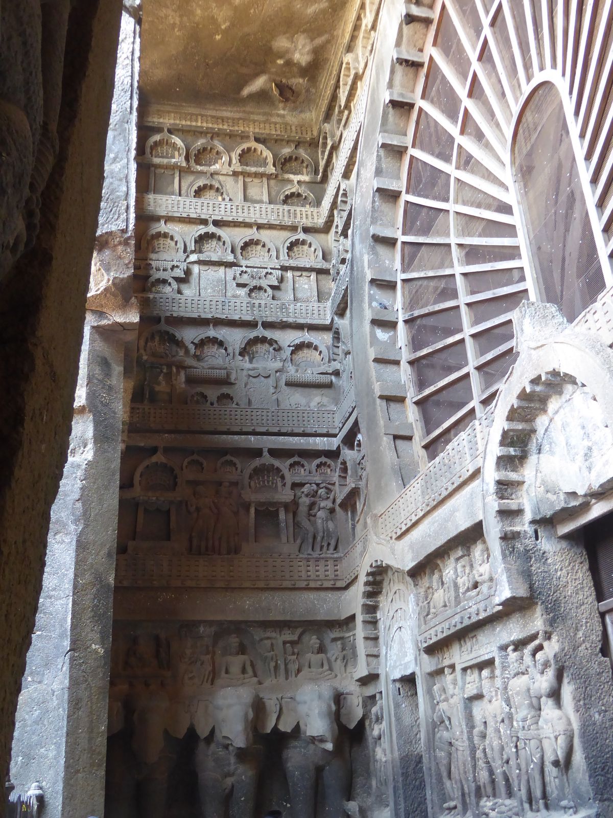 On the sides, too, the Buddhas are later additions, carved under Mahayana influences.