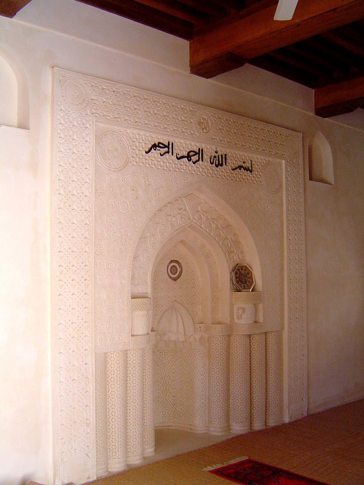 The mihrab of the mosque. No clocks, no microphones, no fluorescent tubes, no framed pictures. Listen to the silence.