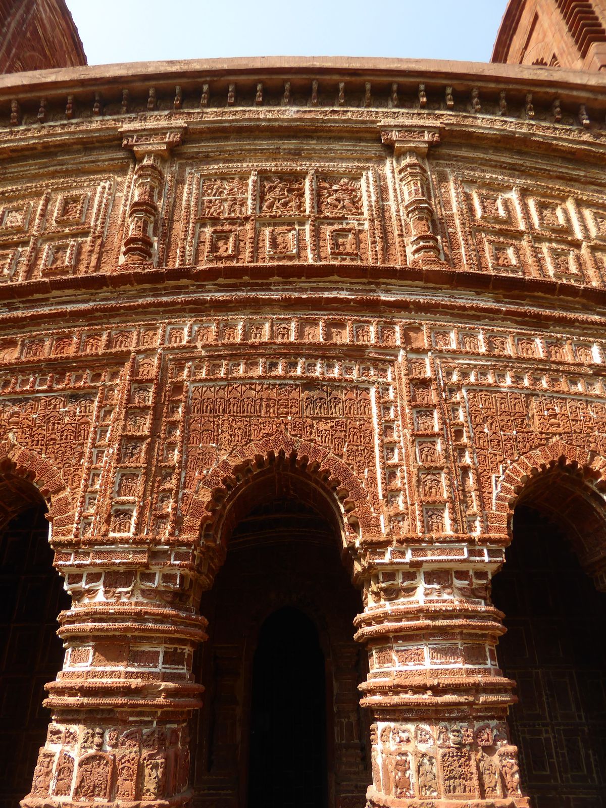 A good deal of the terracotta has been carelessly re-mortared; the ASI has also repaired and replaced parts of this temple's towers with pla