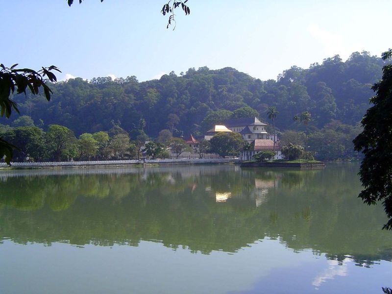 A clear day at the lake, with the Temple of the Tooth under a golden canopy. On days like this, the traditional name of the lake seems perha