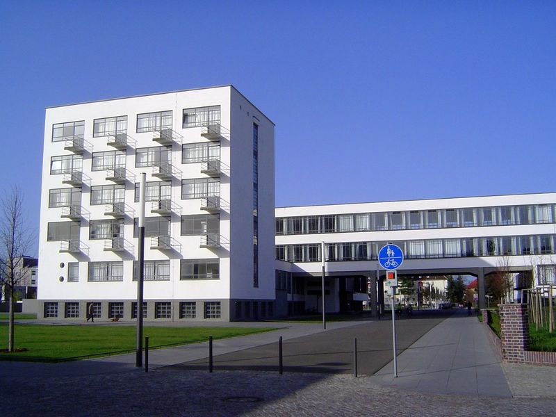 It's Walter Gropius' baby, the famous Bauhaus building. with its iconic bridge across a street. The taller part is the studio building, with