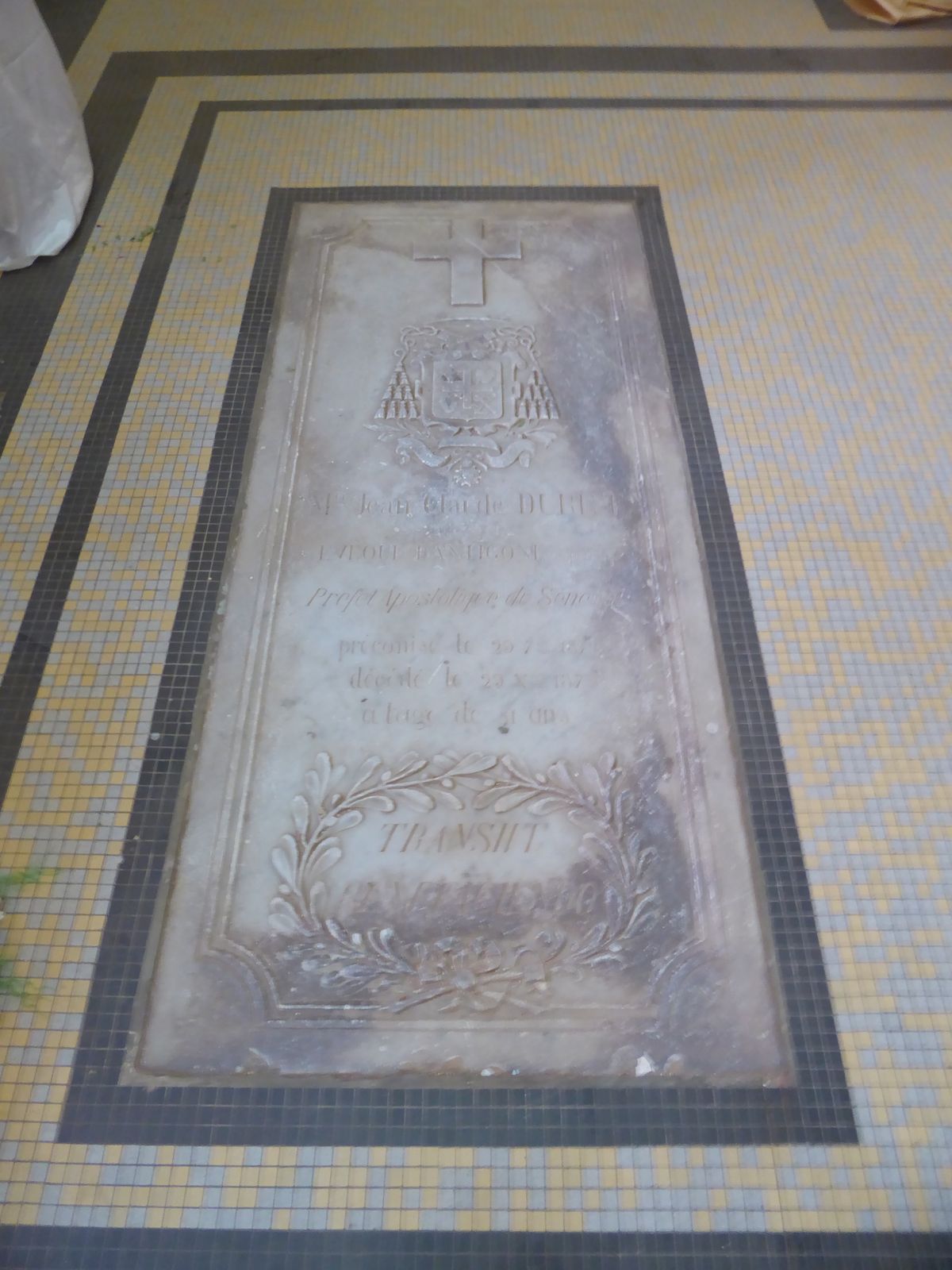 A plaque recalls Bishop Jean-Claude Duret, here from 1856 to 1873; the middle line identifies him as Préfet Apostolique du Senegal.