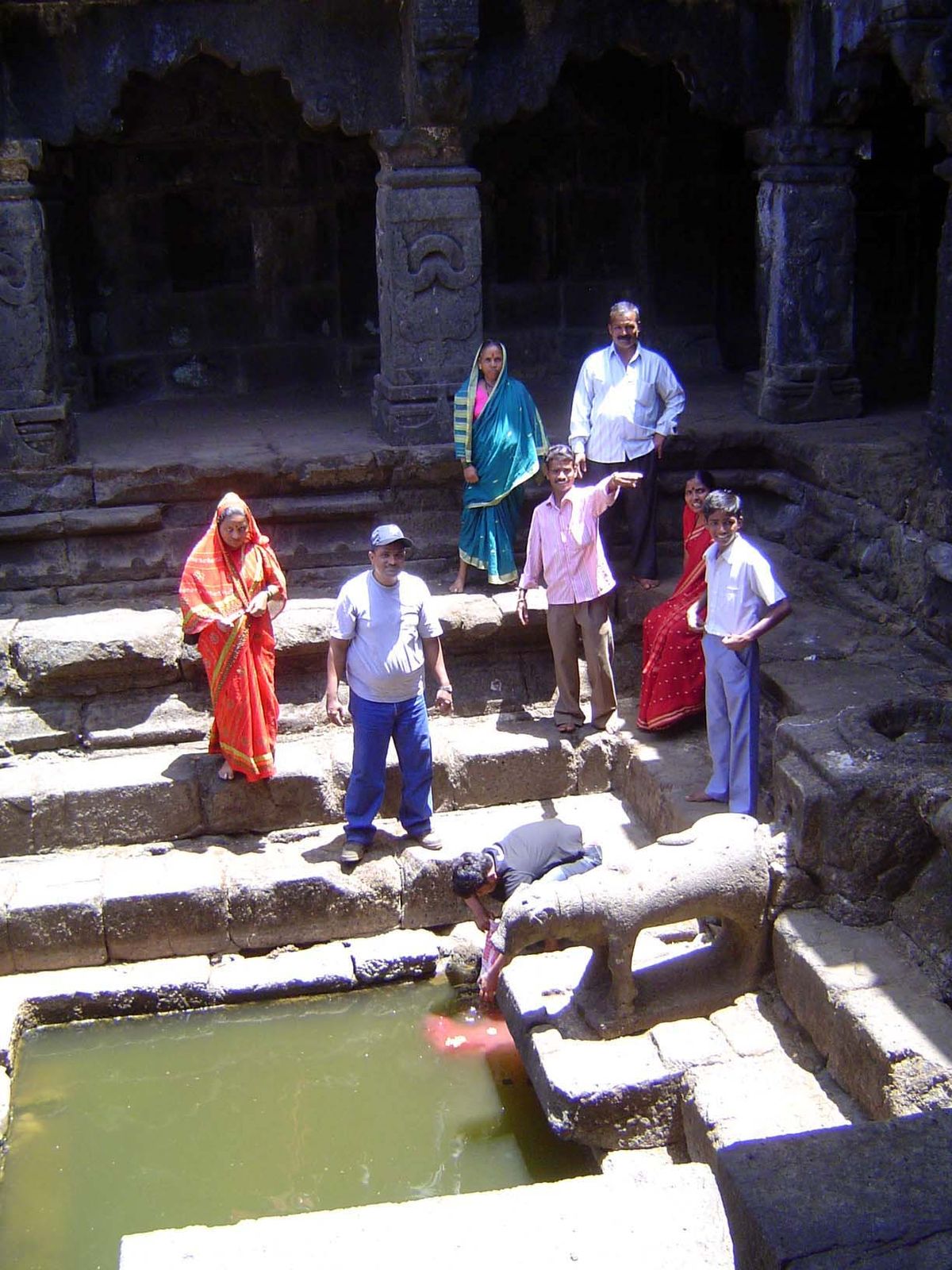 Even in the dry weather, a few people come by to say a prayer and collect a bit of water.