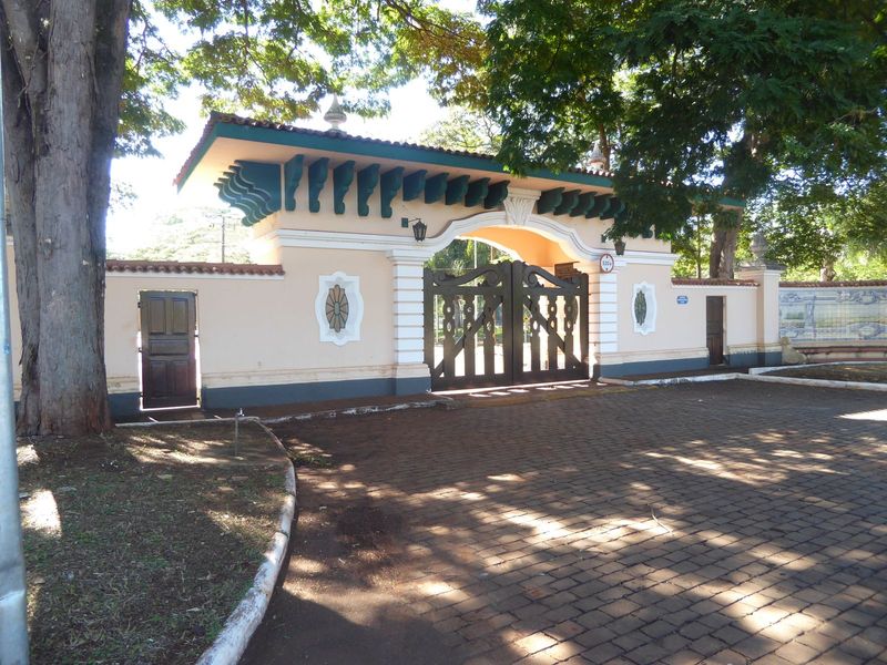 A ceremonial gate tells the story of the farm. See the tiles at the right?