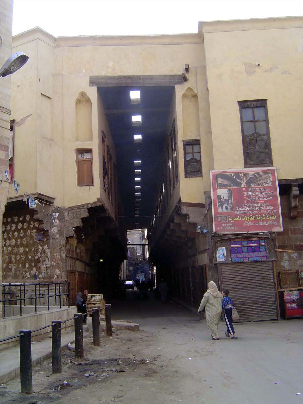 No. 406. This is the last of Cairo's once-common covered streets. It's the Qasaba of Radwan Bey, built in the 17th century. The merchants wo