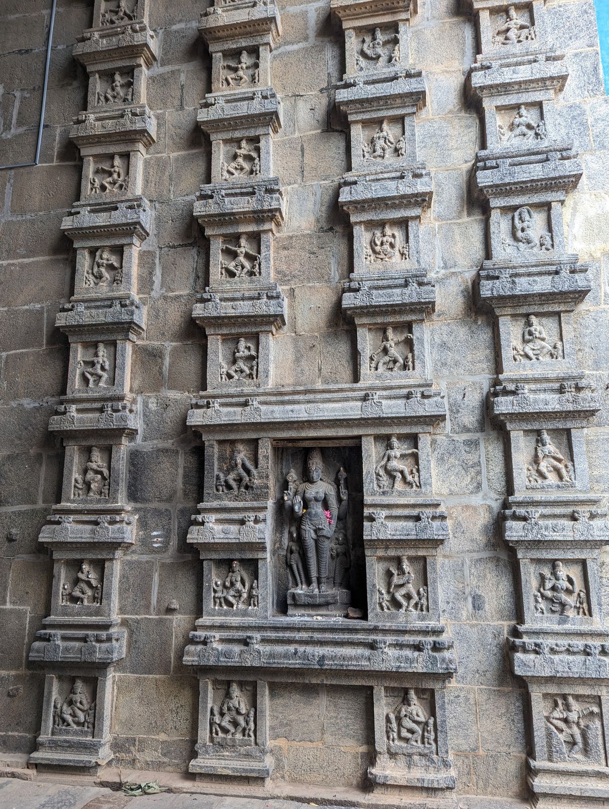Ornamented pillars in the passage.  This temple celebrates Nataraja, or Shiva as the Lord of the Dance.